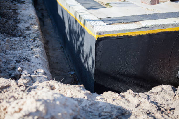 Professional Basement Waterproofing technician working in Litchfield, OH